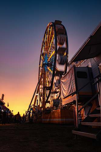 human low angle photo of ferris wheel person